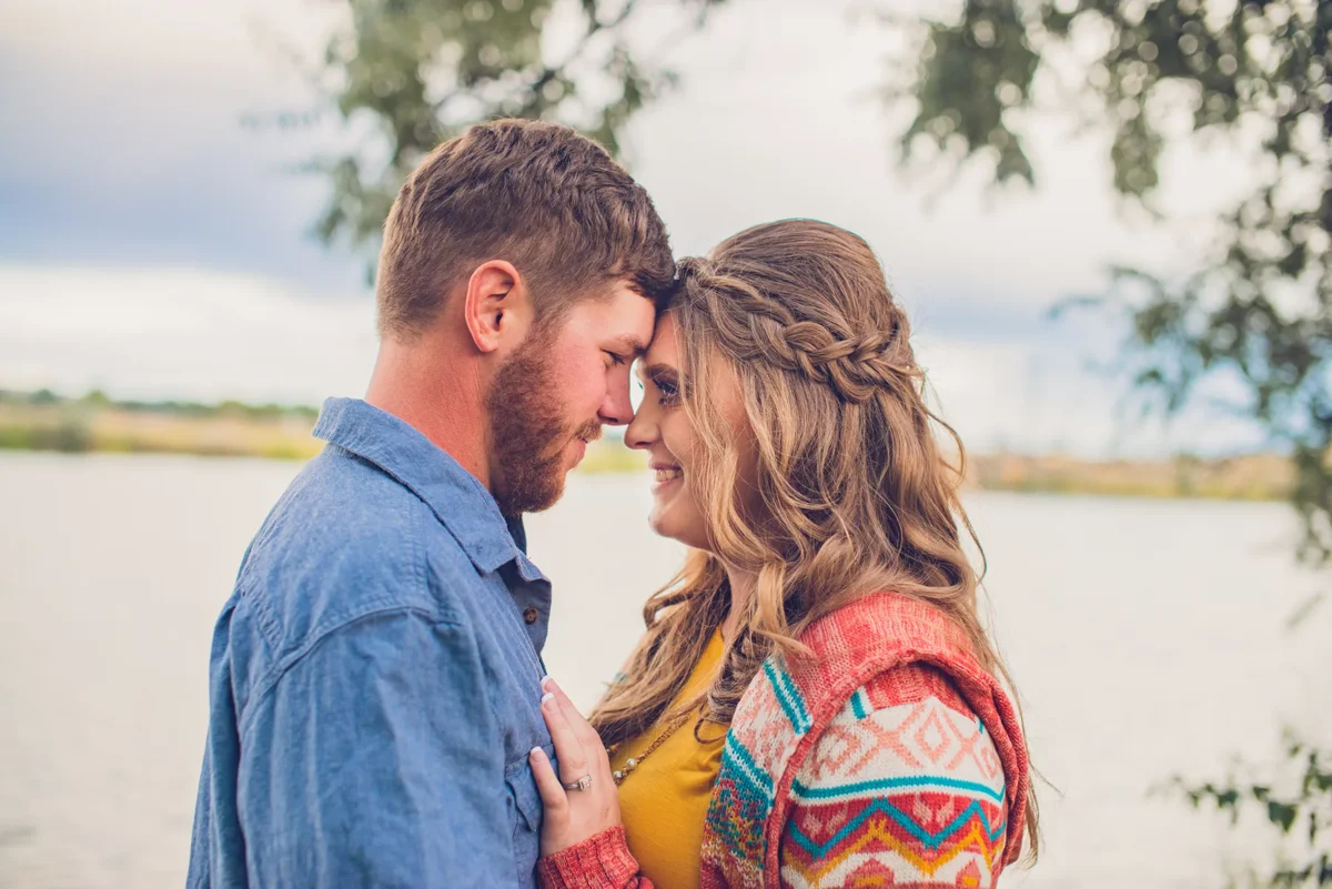 A couple sharing a quiet moment beside the water