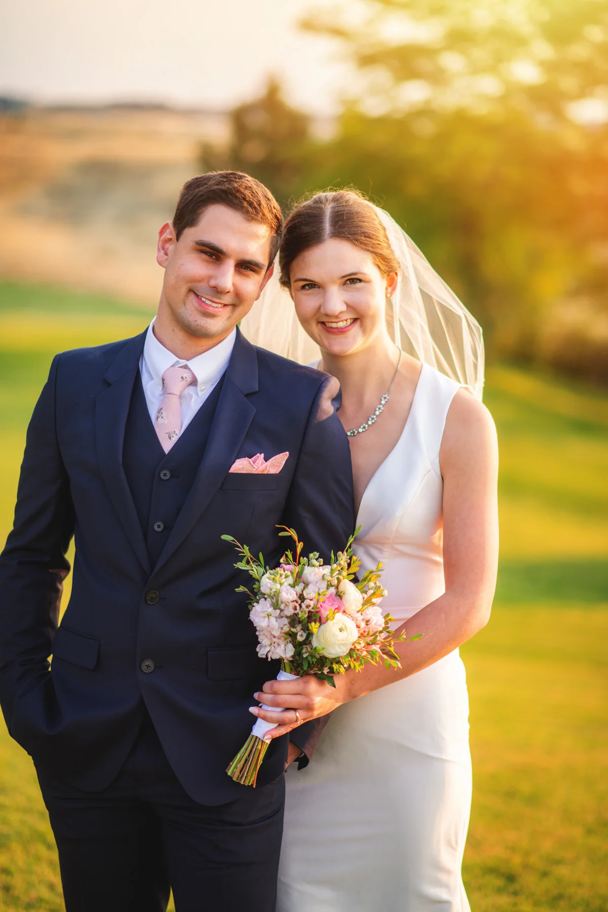 Bride and groom together in soft outdoor light