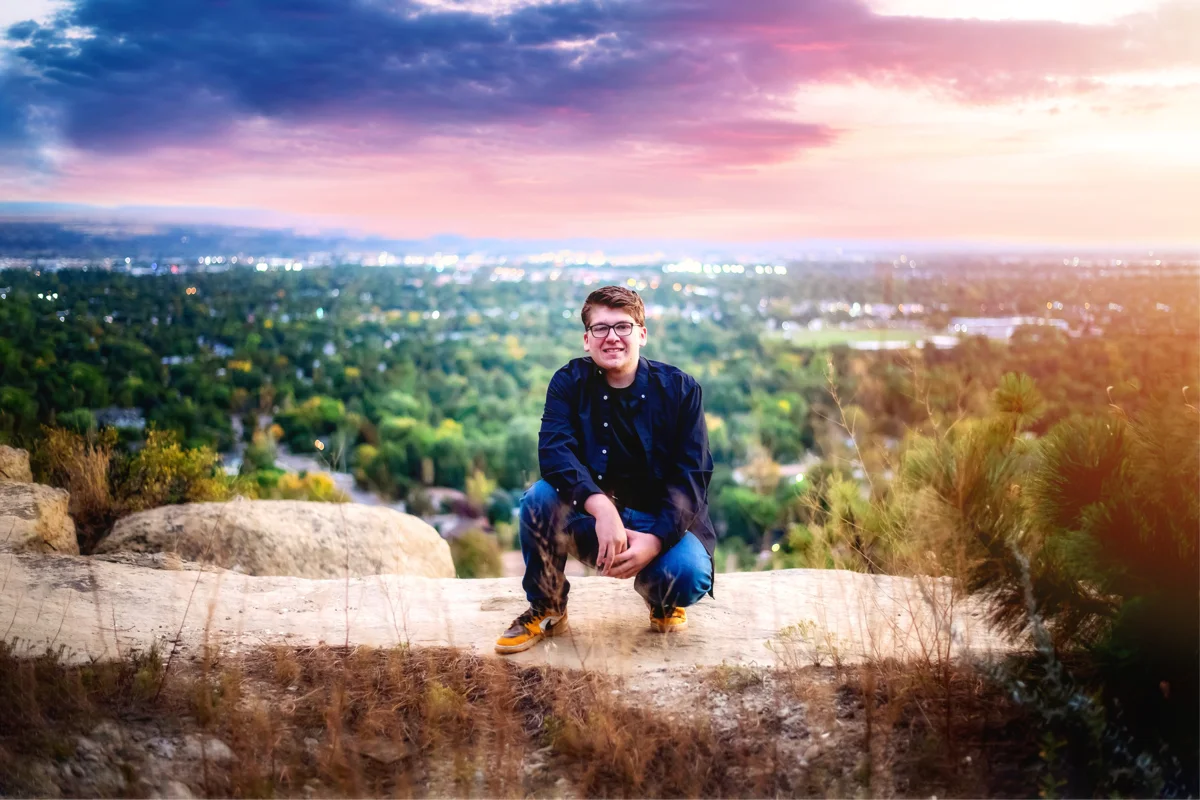 Senior portrait at a sunset overlook