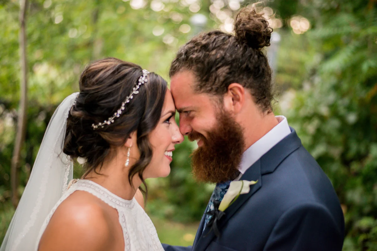 Bride and groom sharing a close moment on their wedding day